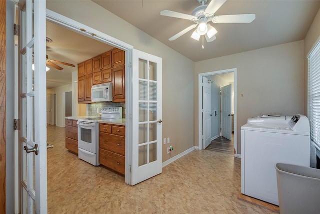 kitchen with ceiling fan, backsplash, white appliances, washing machine and clothes dryer, and french doors