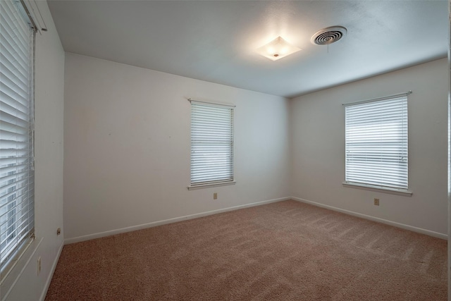 empty room featuring carpet flooring