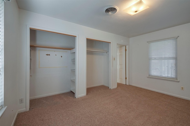 unfurnished bedroom with light carpet