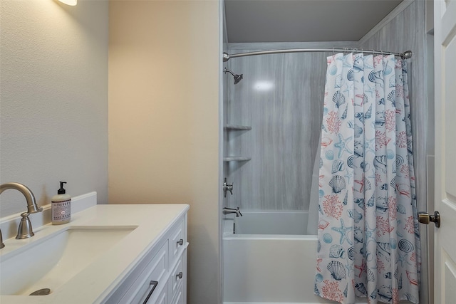 bathroom featuring vanity and shower / bathtub combination with curtain