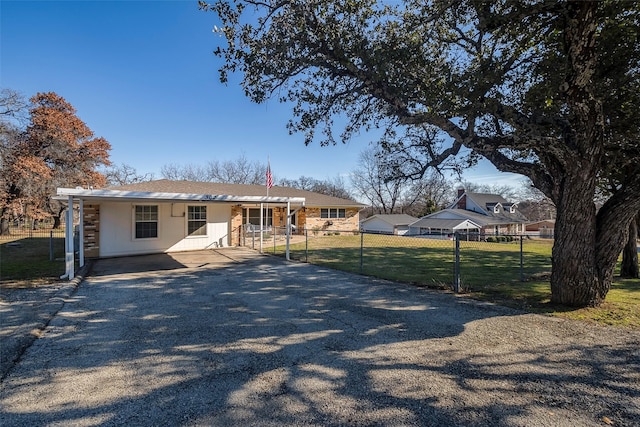 ranch-style house with a front lawn and a carport