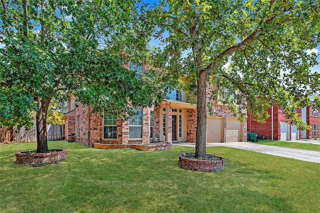 view of front facade featuring a front yard and a garage