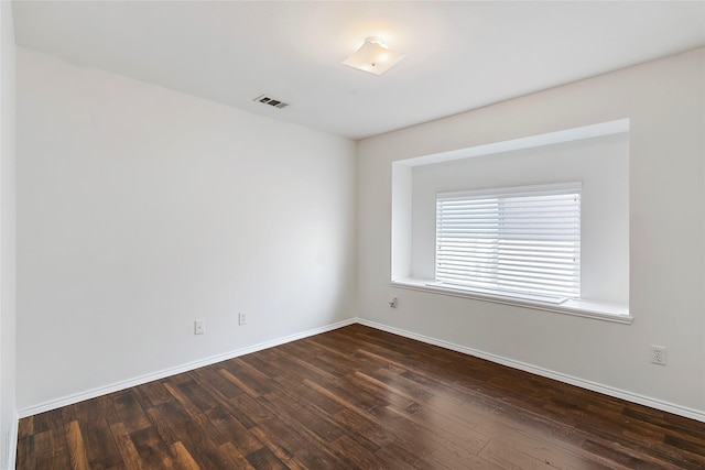 empty room featuring dark hardwood / wood-style floors