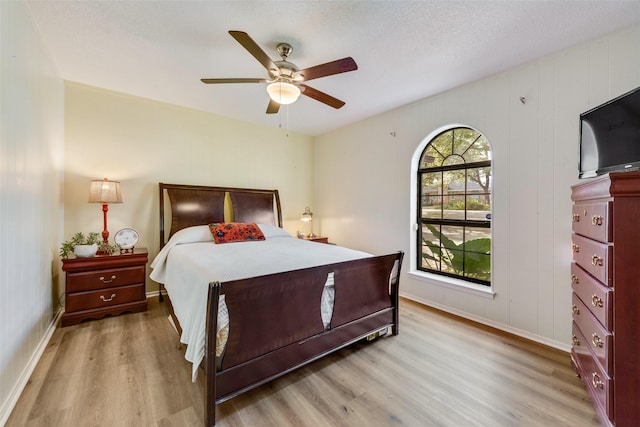 bedroom with ceiling fan and light wood-type flooring