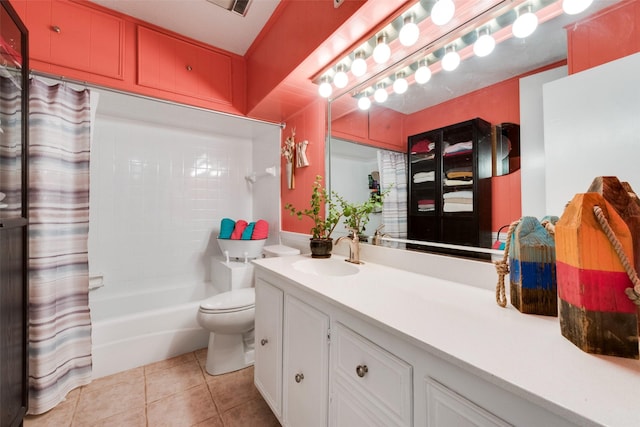 full bathroom featuring toilet, vanity, tile patterned floors, and shower / tub combo with curtain