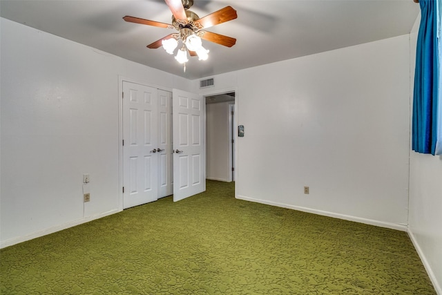 unfurnished bedroom featuring carpet flooring, a closet, and ceiling fan