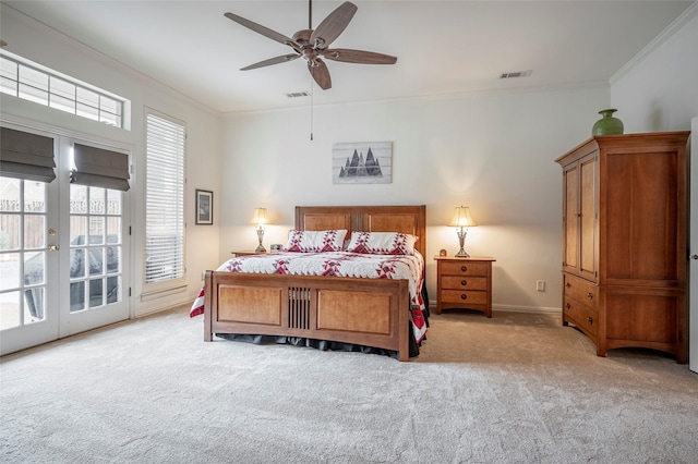 bedroom with ornamental molding, light carpet, and access to exterior