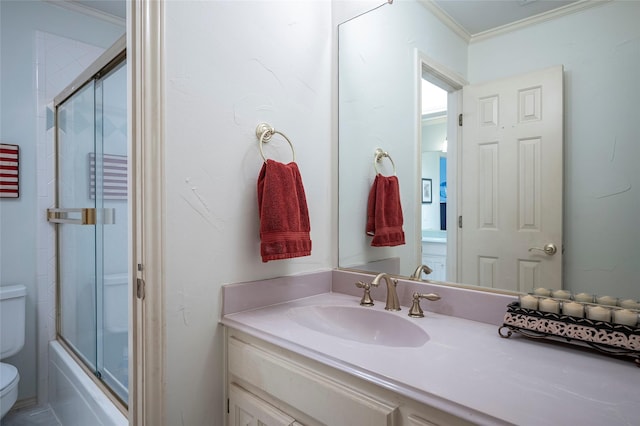 full bathroom featuring crown molding, vanity, toilet, and combined bath / shower with glass door