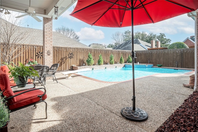 view of pool featuring a patio and ceiling fan