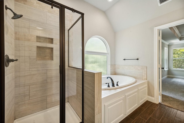 bathroom featuring plus walk in shower