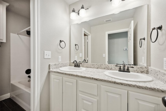 bathroom featuring shower / bathtub combination and vanity