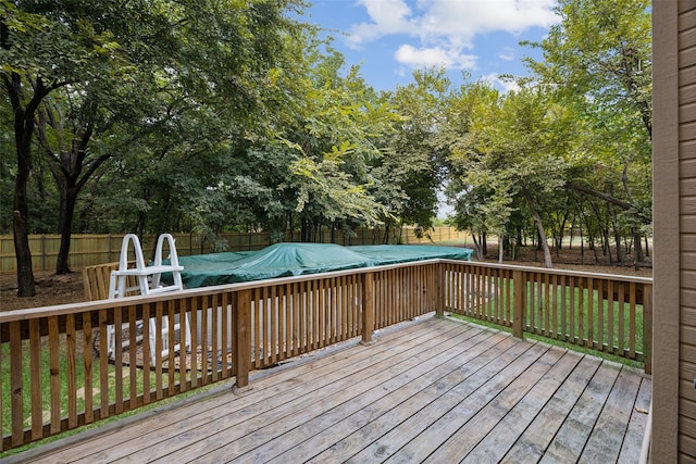 wooden deck with a covered pool