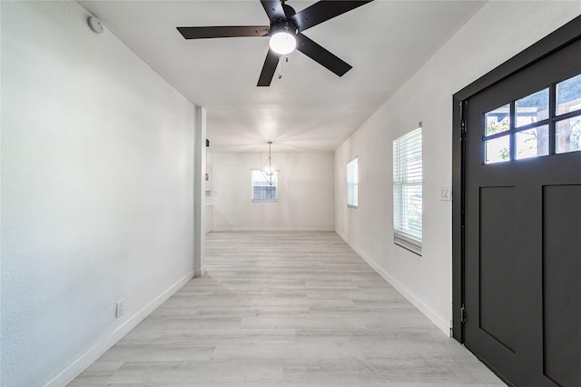 entrance foyer featuring ceiling fan and light wood-type flooring