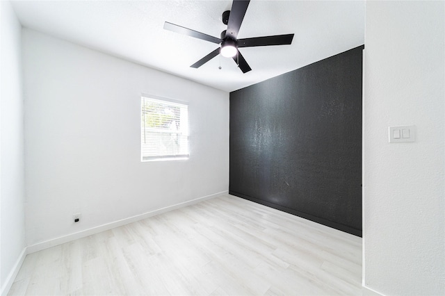 unfurnished room featuring ceiling fan and light hardwood / wood-style flooring