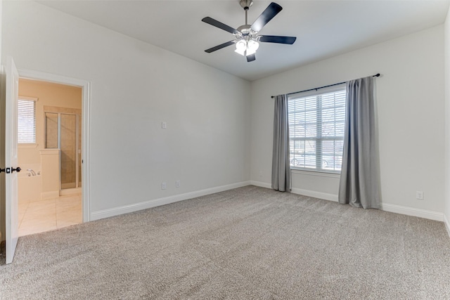 spare room with light carpet and ceiling fan