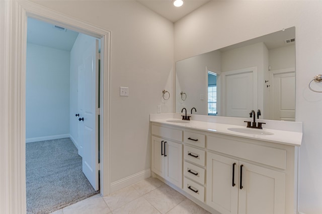 bathroom with tile patterned flooring and vanity