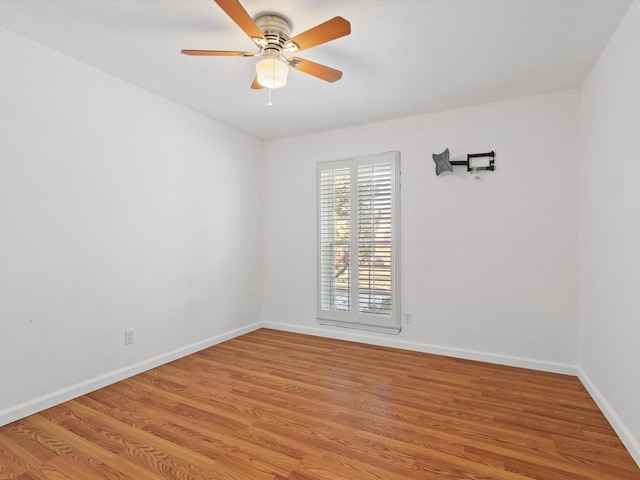 empty room with light wood-type flooring and ceiling fan