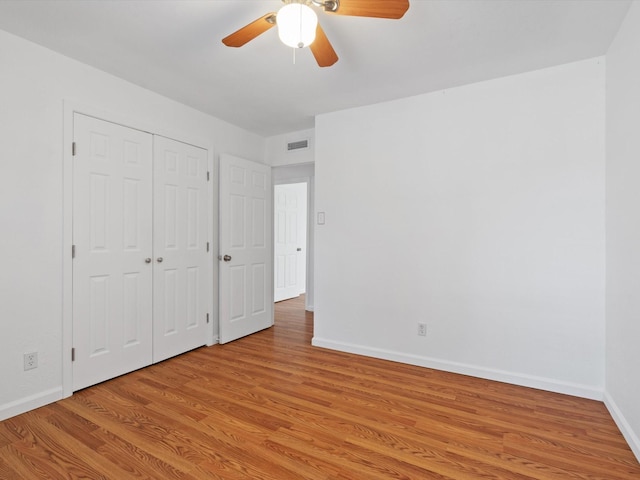 unfurnished bedroom with a closet, ceiling fan, and light hardwood / wood-style floors