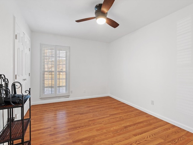 empty room featuring light hardwood / wood-style floors and ceiling fan