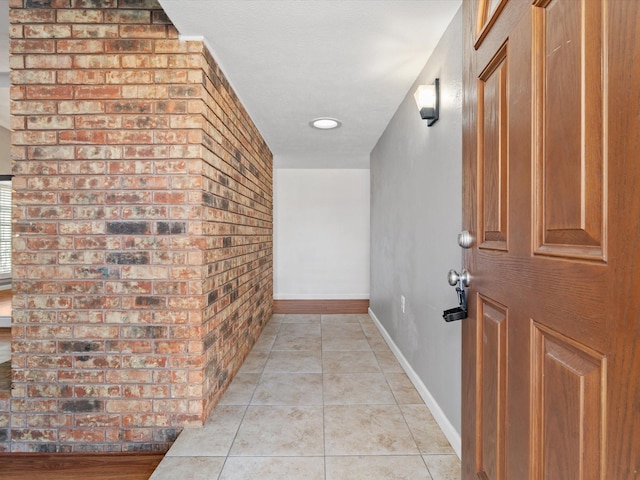 hallway with light tile patterned floors