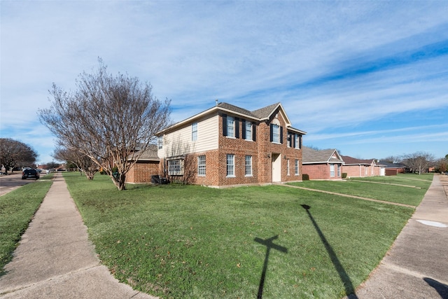 view of side of property featuring a lawn