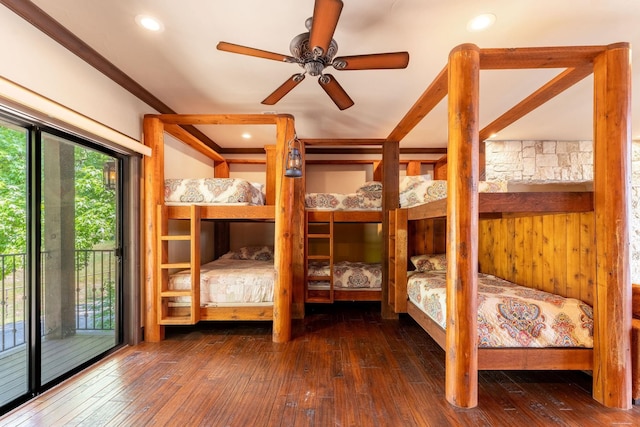 unfurnished bedroom with ceiling fan, dark hardwood / wood-style flooring, and access to exterior