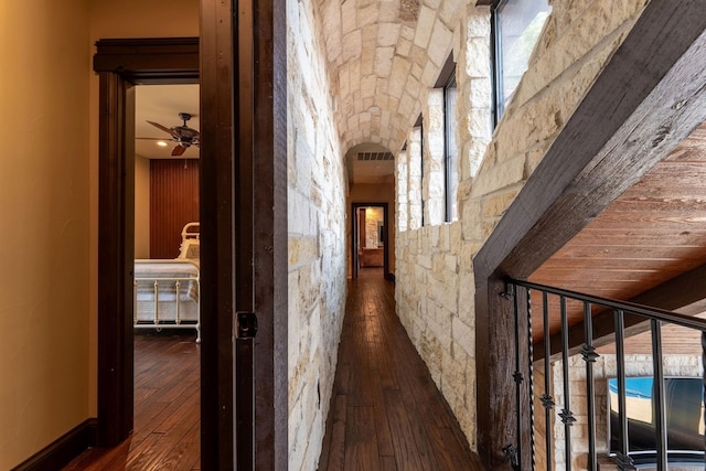 corridor featuring dark hardwood / wood-style flooring