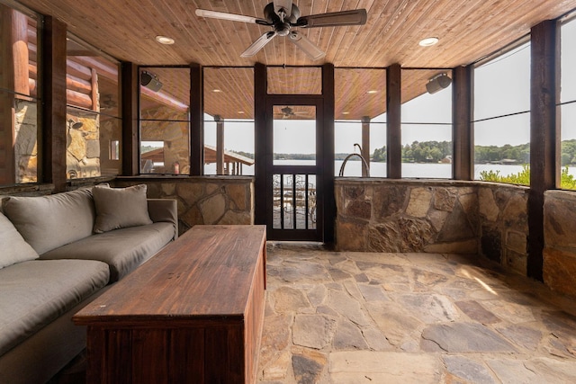 sunroom / solarium with ceiling fan, a water view, wooden ceiling, and plenty of natural light