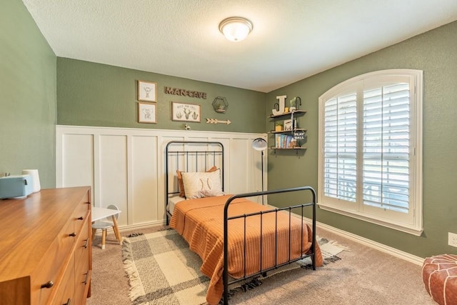 bedroom featuring light colored carpet