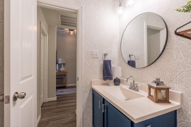 bathroom with vanity and wood-type flooring