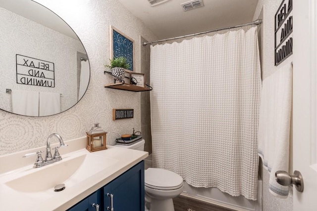 full bathroom with toilet, vanity, shower / bath combo with shower curtain, and hardwood / wood-style flooring