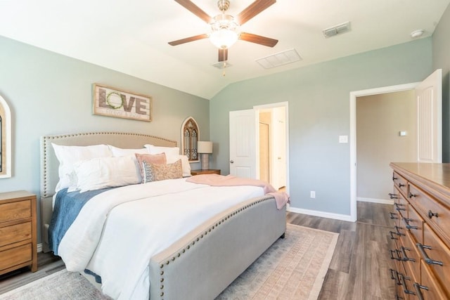 bedroom featuring ceiling fan, vaulted ceiling, and dark hardwood / wood-style flooring