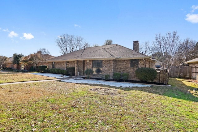 ranch-style home with a front yard