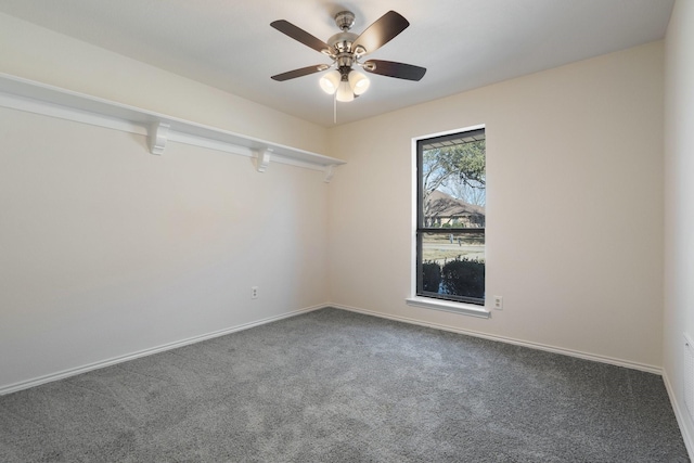 carpeted empty room featuring ceiling fan