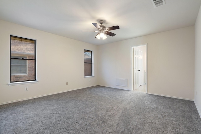 carpeted empty room with ceiling fan