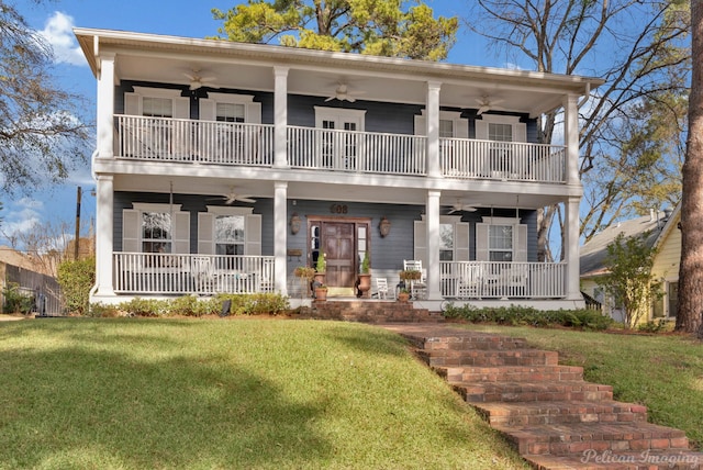 view of front of house with covered porch, a balcony, and ceiling fan