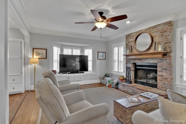 living room with light hardwood / wood-style floors and crown molding