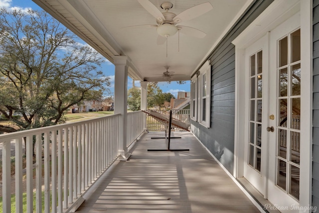 balcony featuring ceiling fan and covered porch