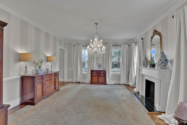 interior space featuring a notable chandelier, light hardwood / wood-style floors, and crown molding