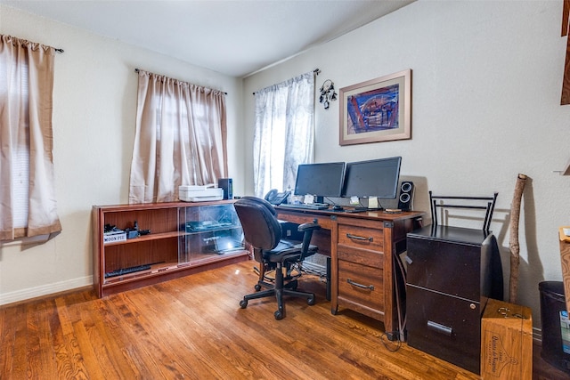 office space with dark wood-type flooring