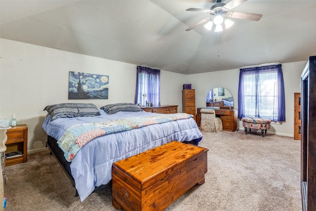 carpeted bedroom featuring vaulted ceiling and ceiling fan