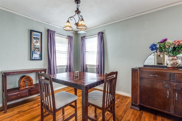 dining space with crown molding and dark hardwood / wood-style floors