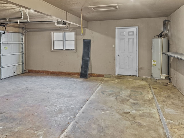 garage with electric water heater and a garage door opener