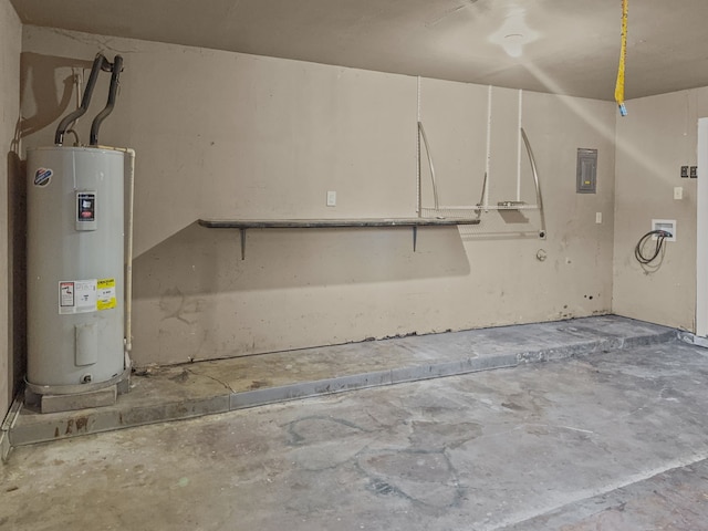 garage featuring water heater and electric panel