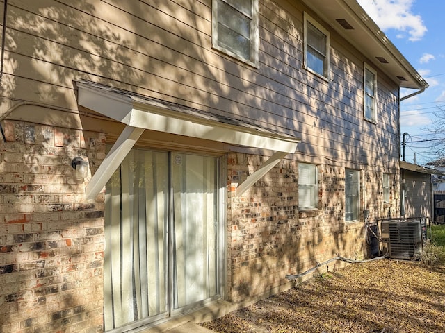 view of side of property with cooling unit