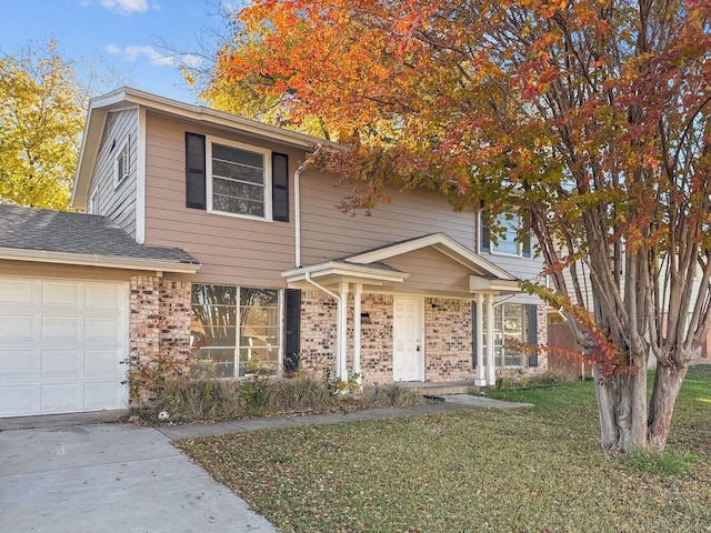 view of front property with a front yard and a garage