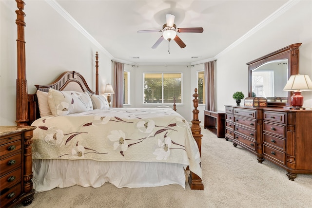 bedroom featuring ceiling fan, ornamental molding, and carpet flooring