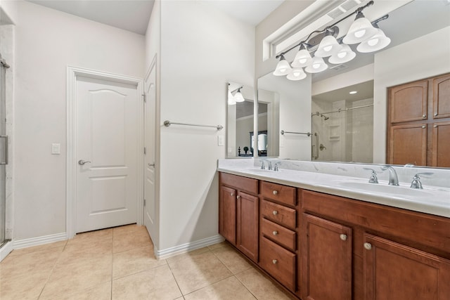 bathroom featuring vanity, tile patterned flooring, and a shower with shower door