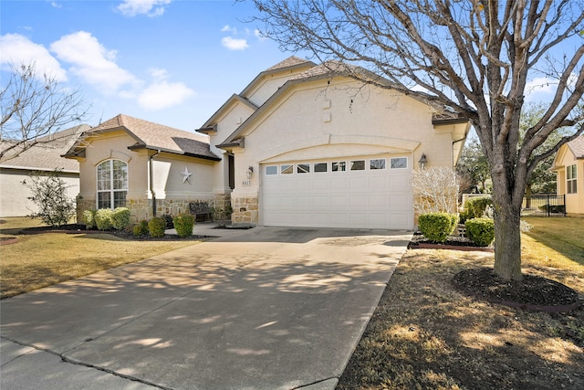 view of front of property featuring a front lawn and a garage