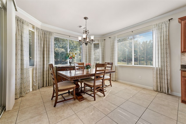 tiled dining area featuring an inviting chandelier and crown molding